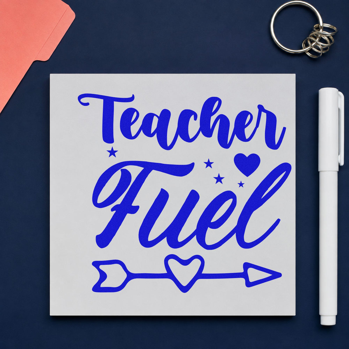 Teacher Fuel Heart Arrow craft stamp in blue ink on cardstock, an easy option for lunch bag panels.