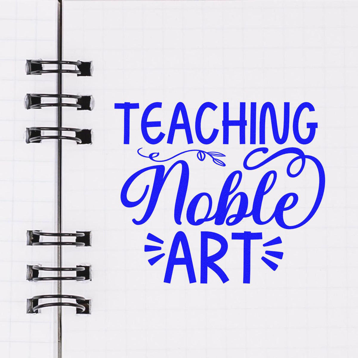 Blue Teaching Noble ART stamp and seal design on white notebook page with spiral binding