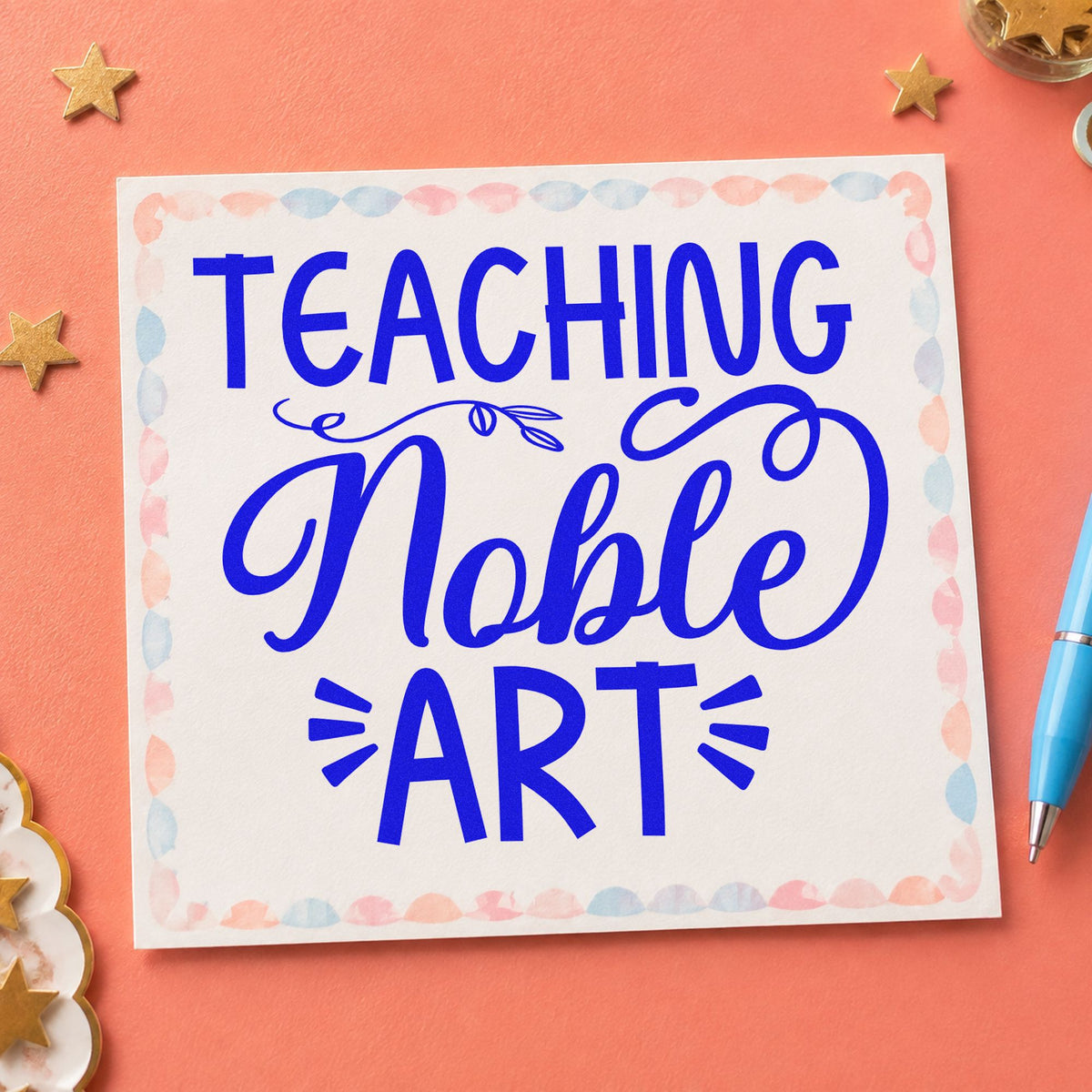 Teaching Noble Art Flourishes craft stamp imprinted in blue ink on paper, a design suited to catalog seals.