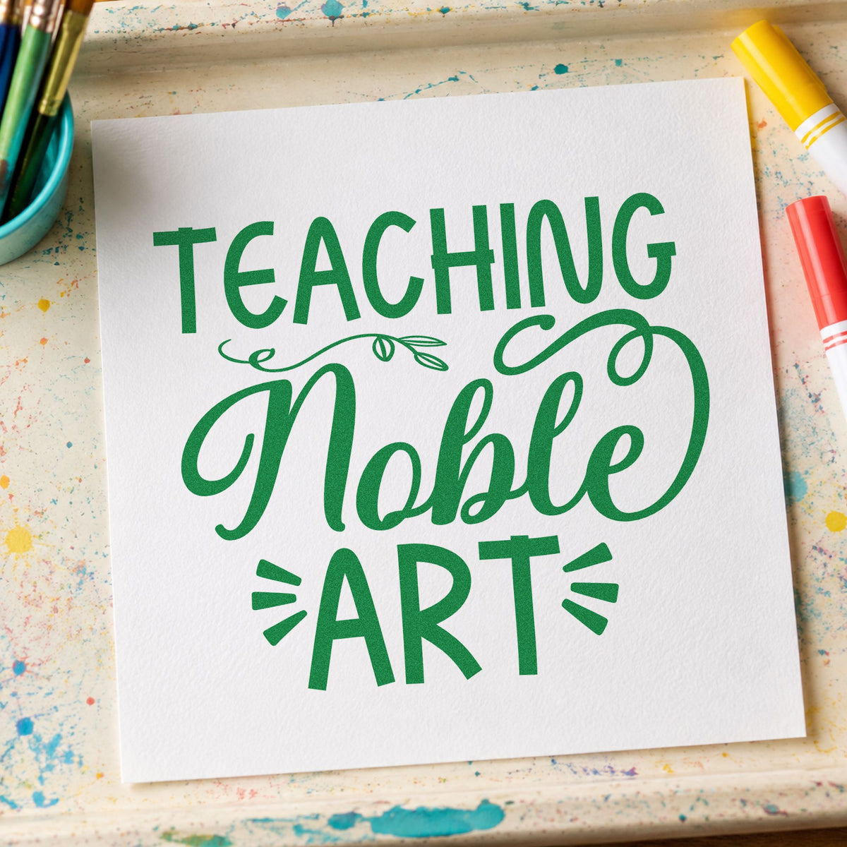 Teaching Noble Art Flourishes craft stamp imprint in green ink on a handmade project, one idea being framed gallery wall.