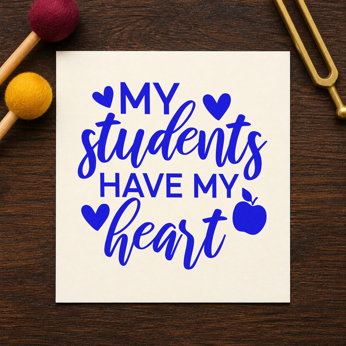Students Have My Heart Apple craft stamp imprinted in blue ink on paper, a design suited to letter fold seals.