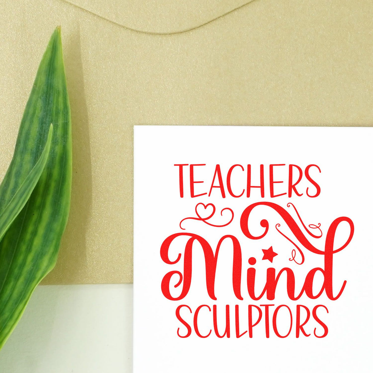 Custom red teacher stamp seal on white card with gold background and green leaf, reading Teachers Mind Sculptors