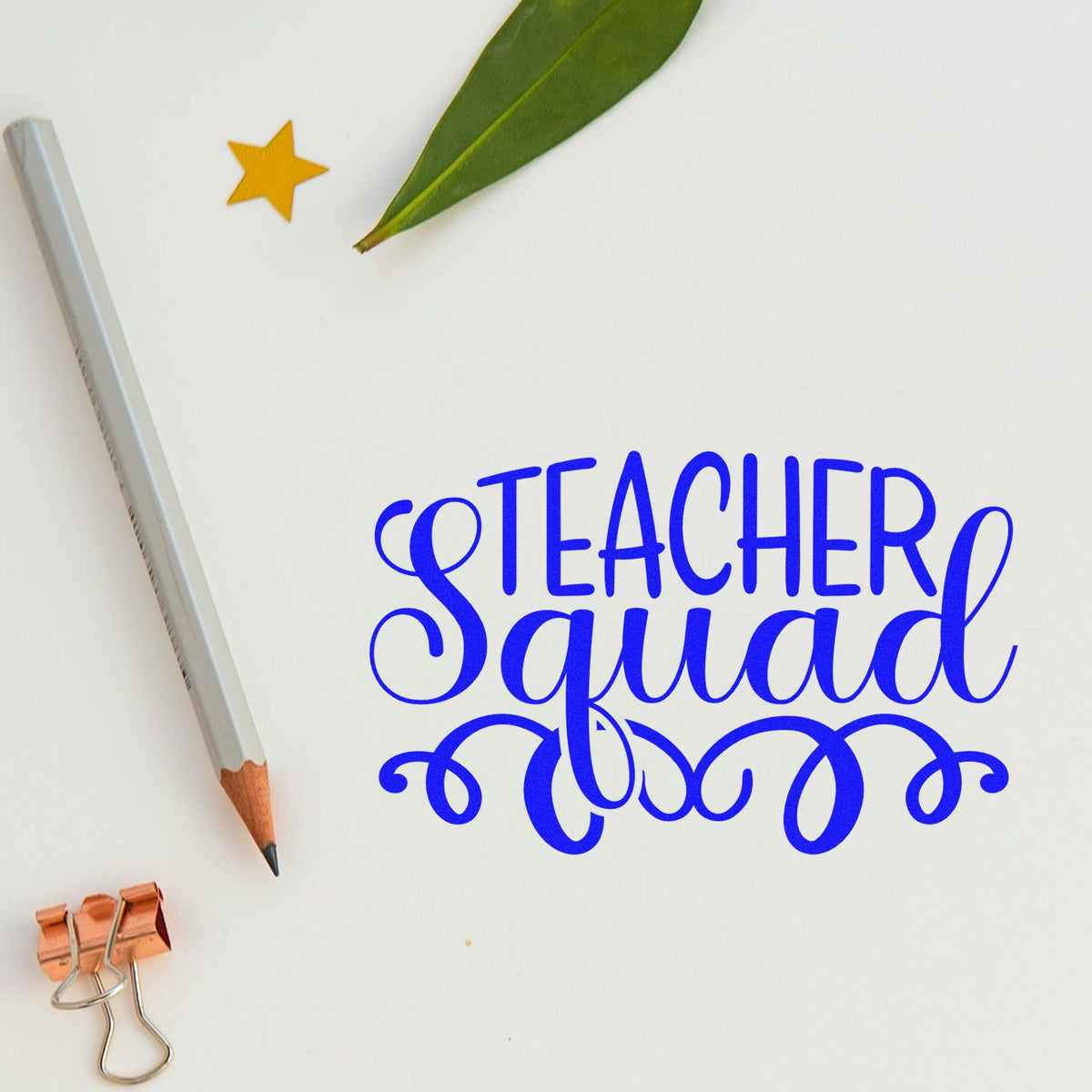 Blue Teacher Squad stamp and seal design with pencil, leaf, gold star, and copper binder clip on white background.