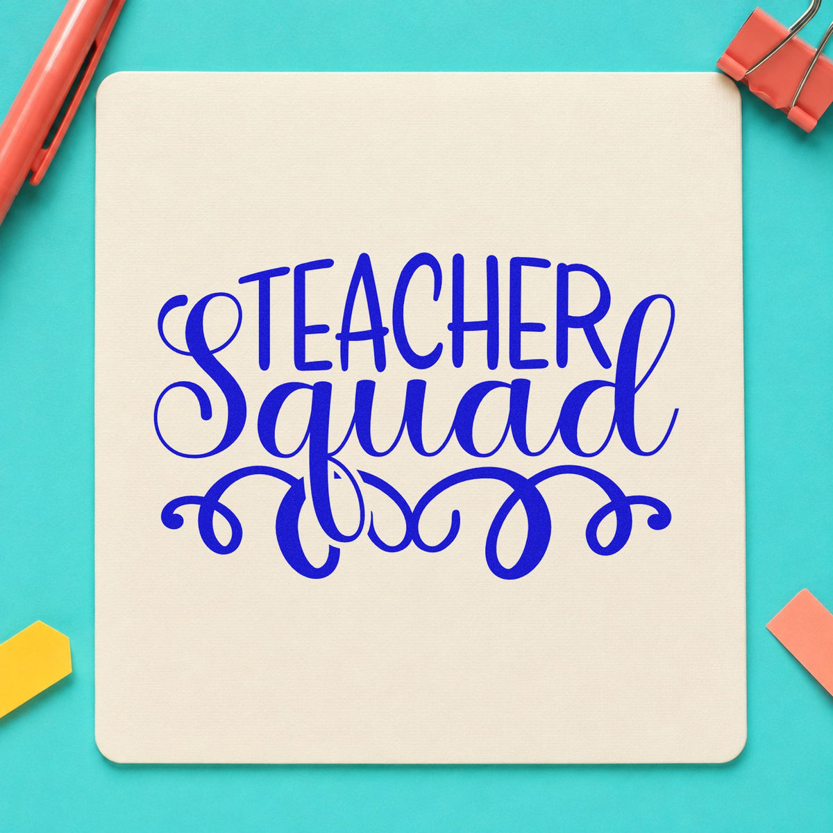 Teacher Squad Script Flourishes craft stamp imprinted in blue ink on paper, a design suited to invite card seals.