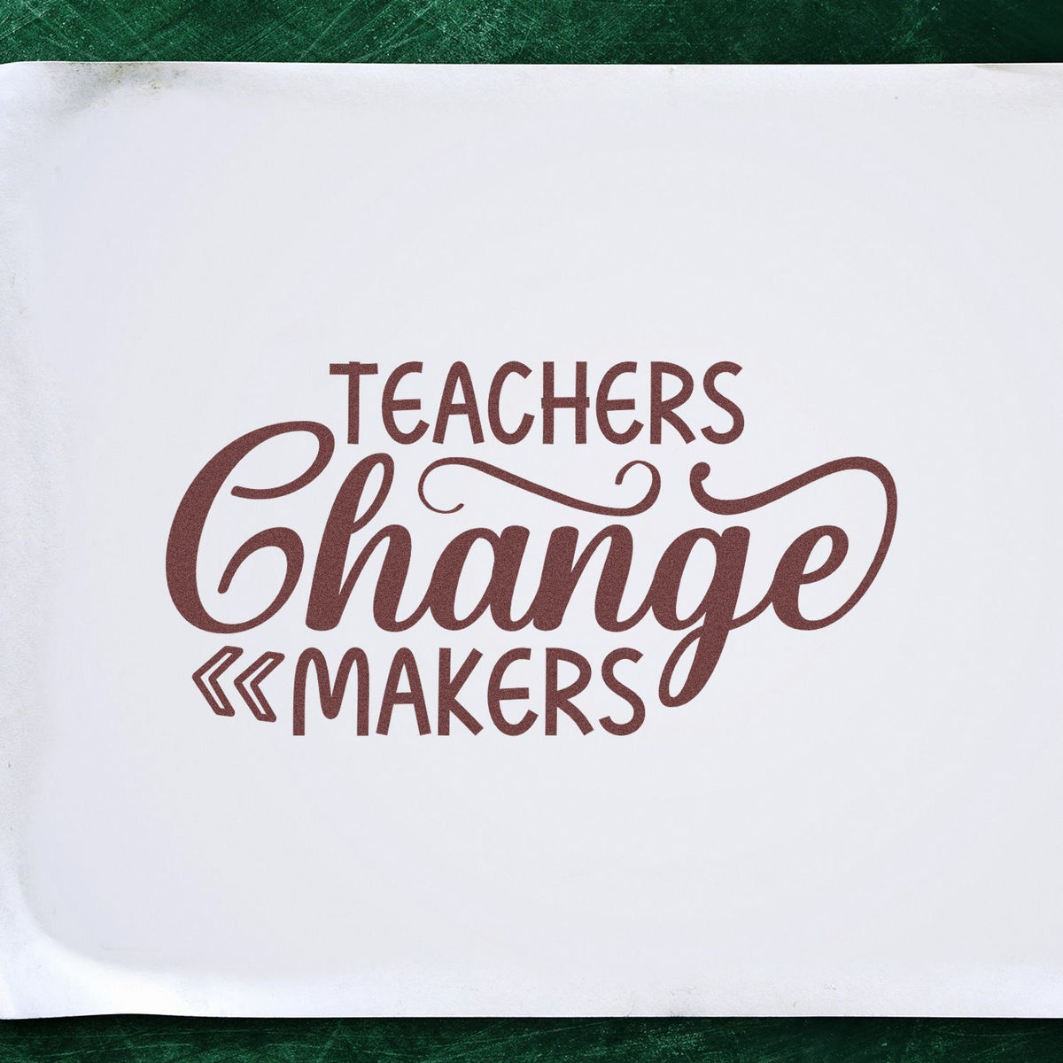 Maroon Teachers Change Makers stamp seal on white paper with decorative script and bold lettering.
