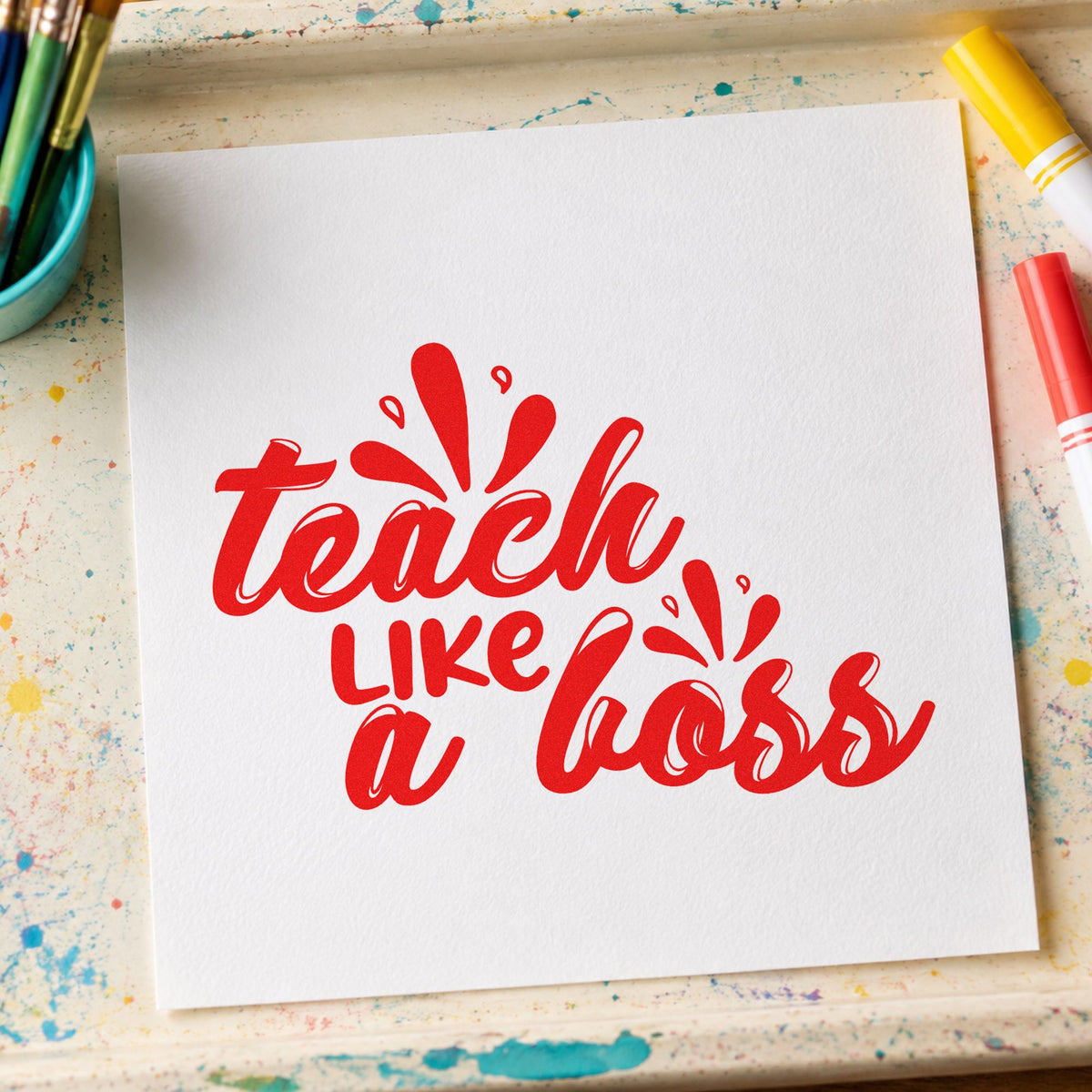 Teach Like A Boss rubber stamp shown in red ink, stamped for projects such as messy play notes.