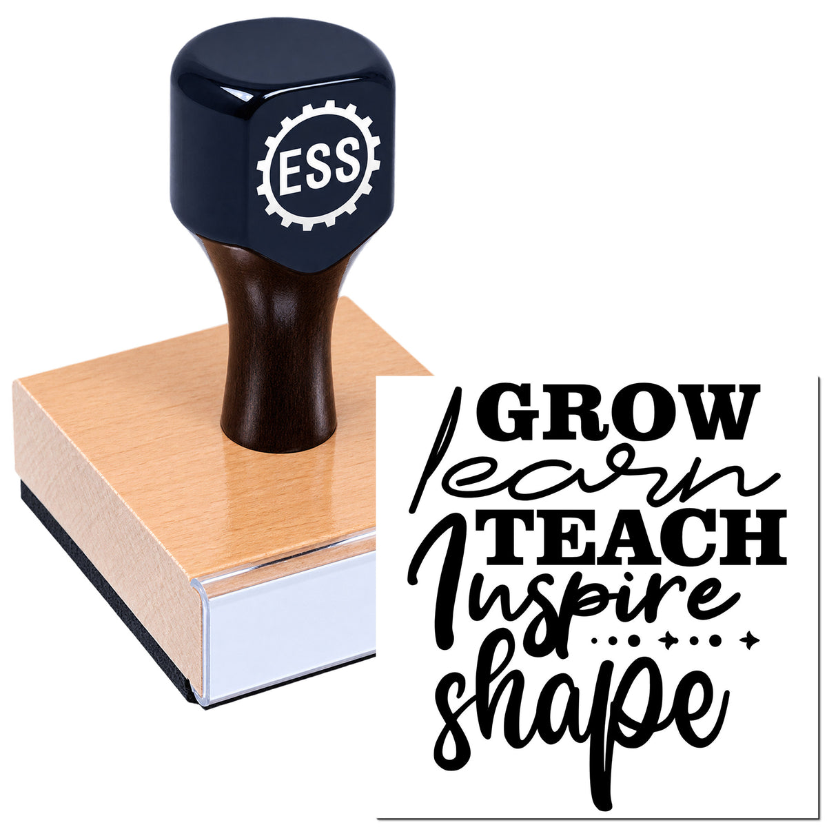 Dark navy ESS rubber stamp seal on a pink wooden block, with black "Grow Learn Teach Inspire Shape" lettering