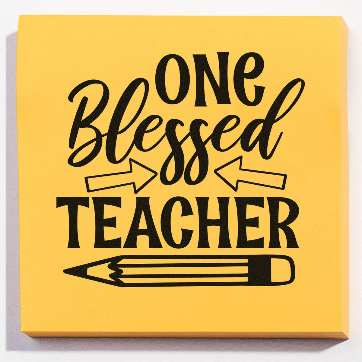 Yellow teacher stamp seal with black One Blessed Teacher text, arrows, and pencil graphic.
