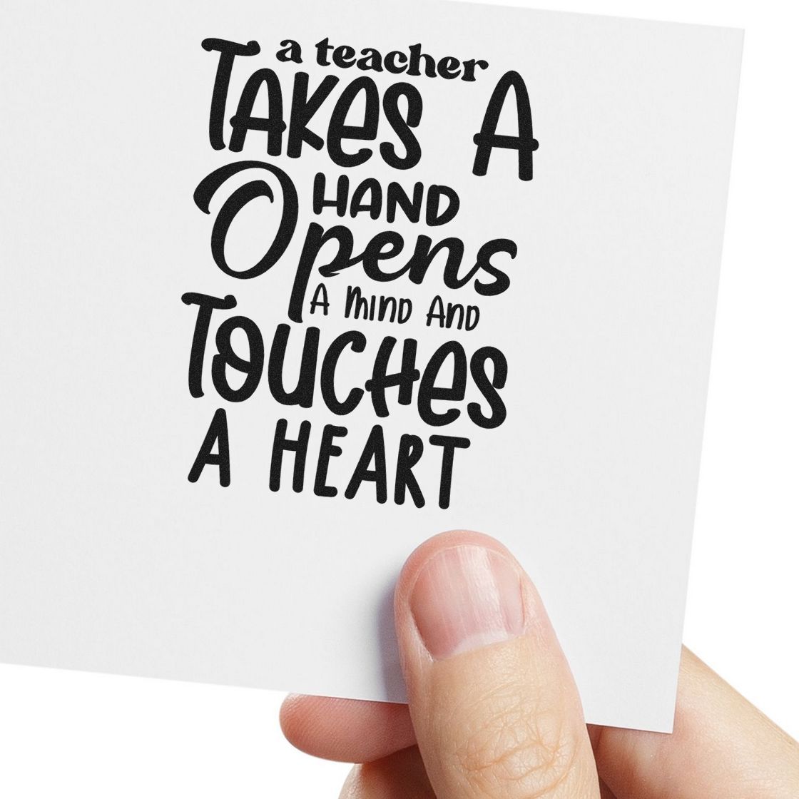 Black teacher appreciation stamp seal on white card, held by hand, with quote: A teacher takes a hand and touches a heart.