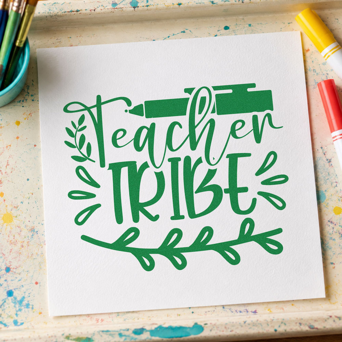 Teacher Tribe Pen And Leaves craft stamp imprint in green ink on a handmade project, one idea being sowing chart pages.