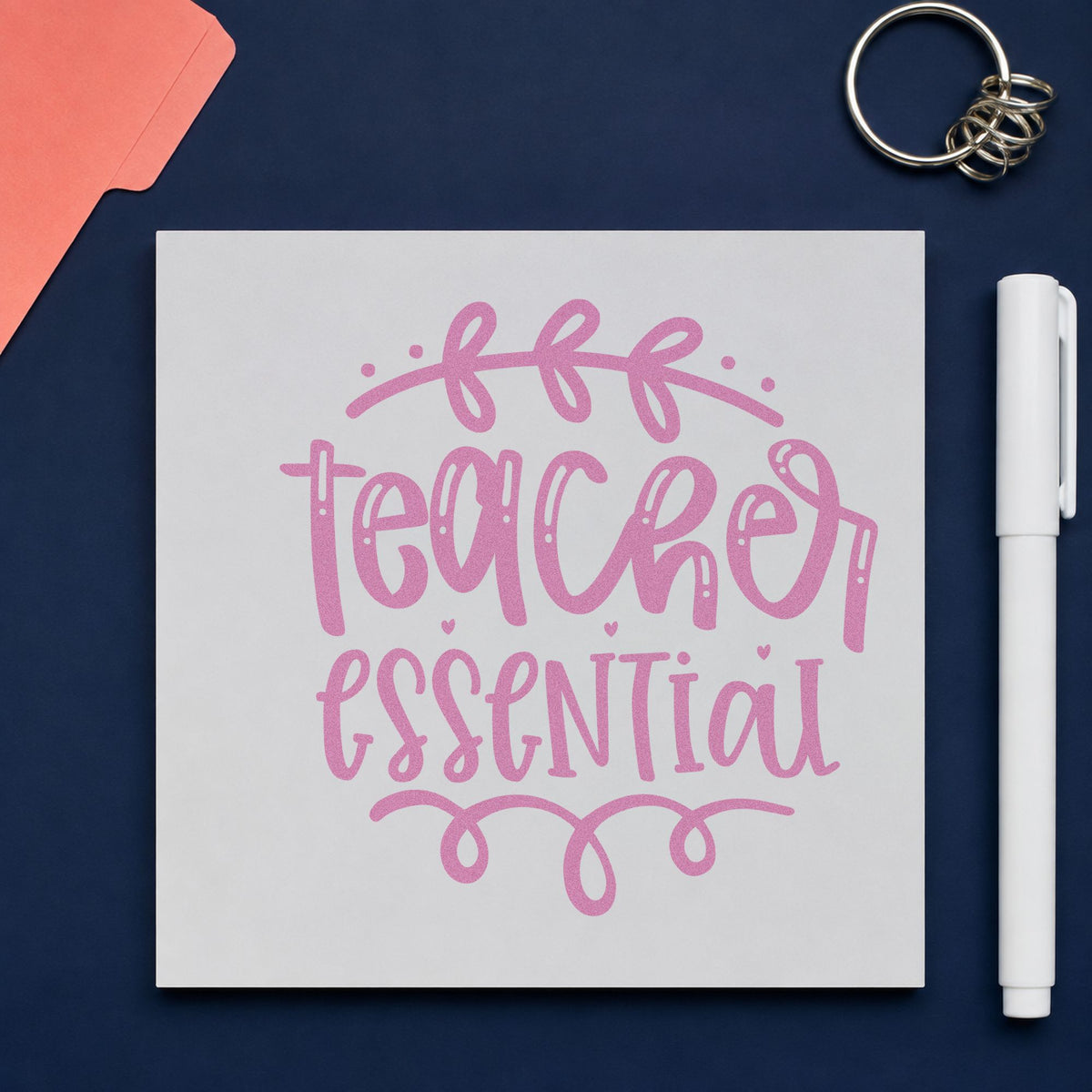 Teacher Essential Leafy Flourish craft stamp in purple ink on cardstock, an easy option for bundle item tags.