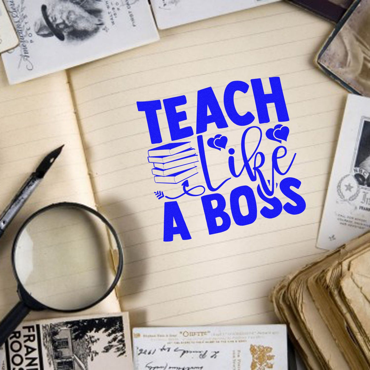 Blue Teach Like a Boss custom stamp with hearts and books on a lined notebook, surrounded by vintage seals and stationery