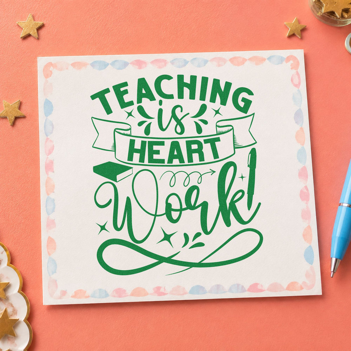 Teaching Is Heart Work craft stamp imprint in green ink on a handmade project, one idea being annual report pages.
