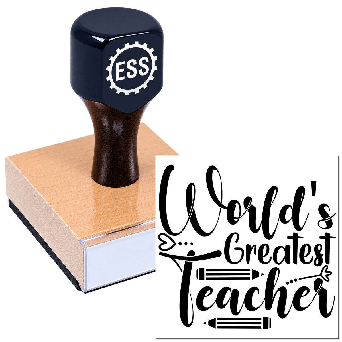 Dark navy ESS rubber stamp on wooden seal block with black "World's Greatest Teacher" script and pencil accents.
