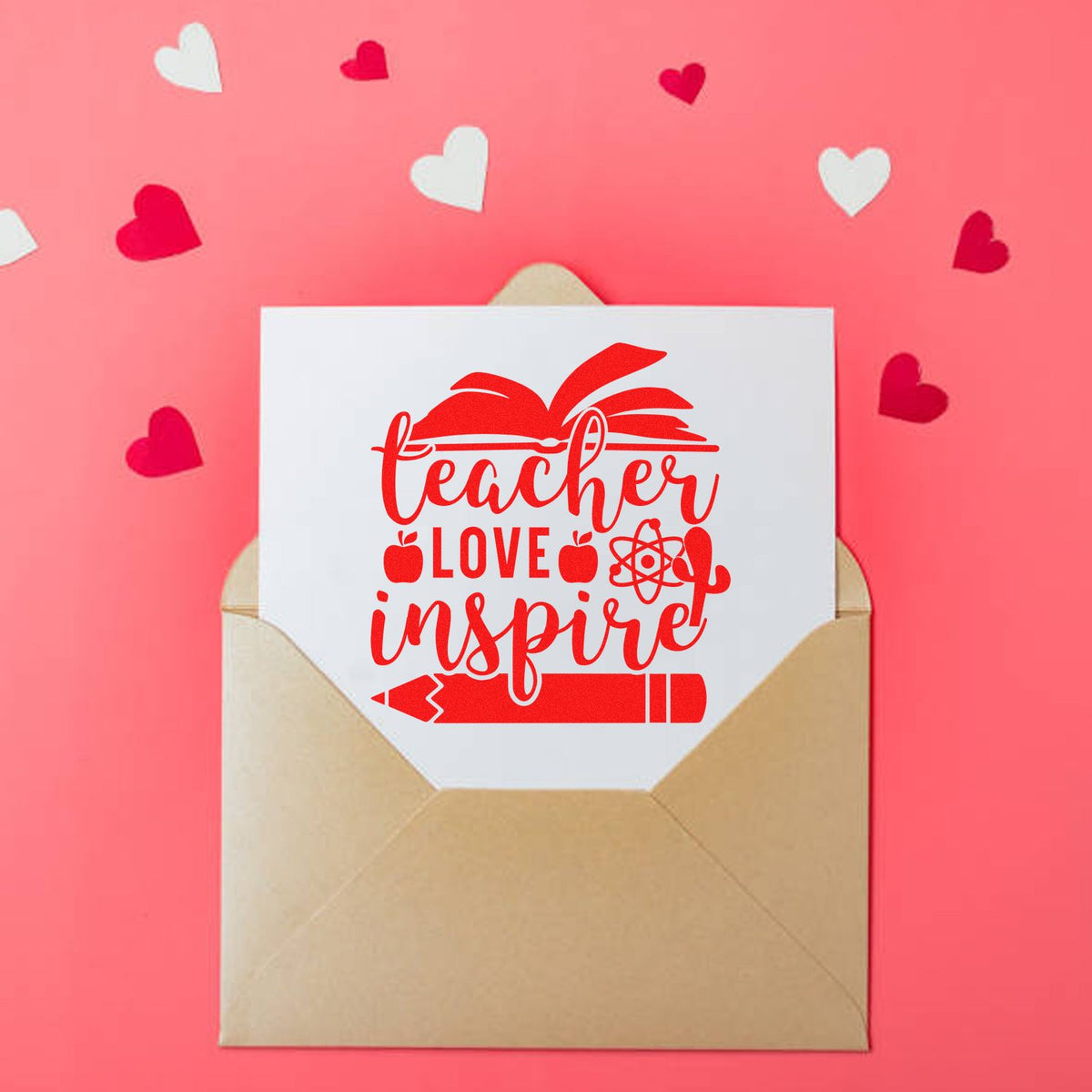 Red teacher love inspire stamp and seal design on white card in tan envelope, with pink background and heart cutouts.