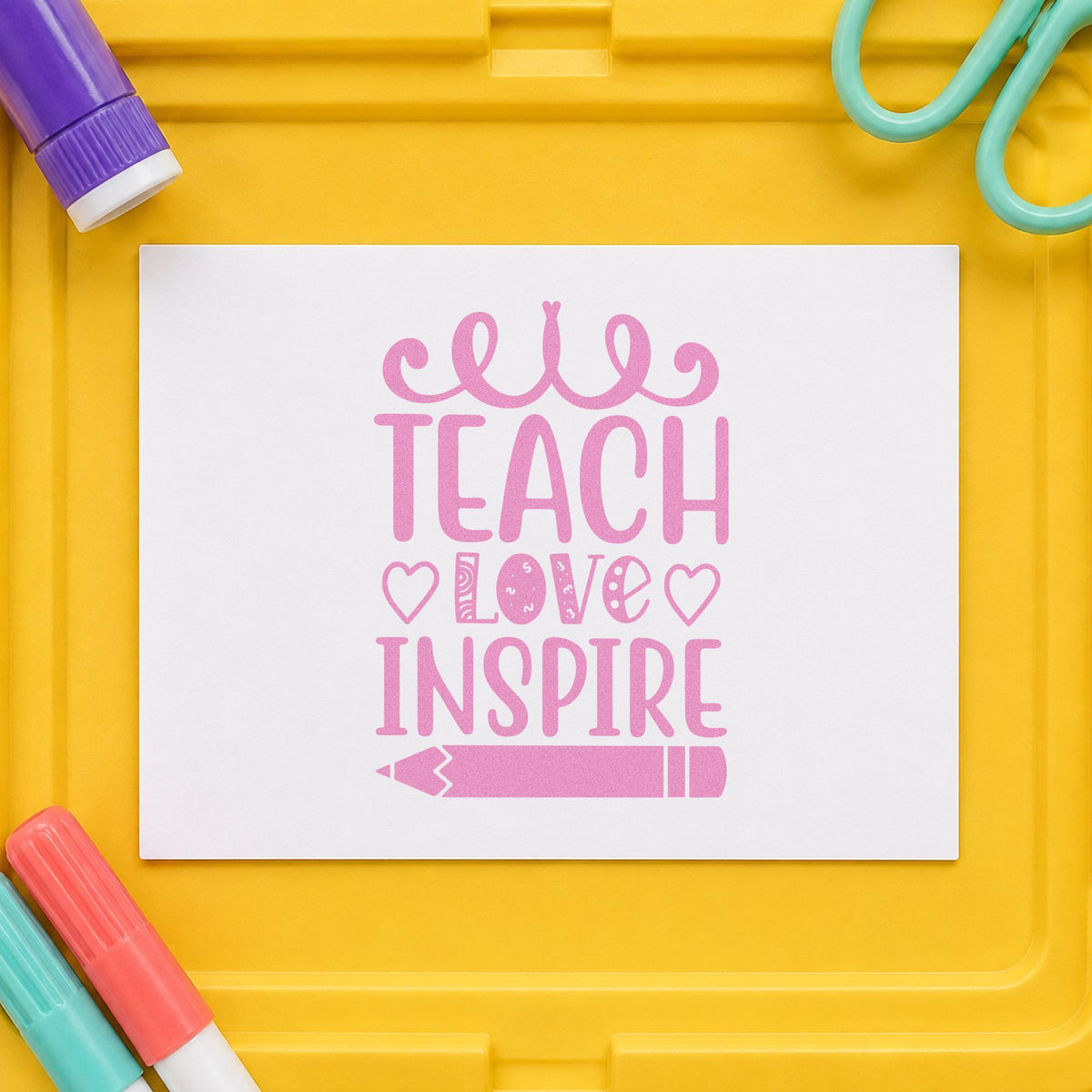 Teach Love Inspire Hearts Pencil craft stamp in purple ink on cardstock, an easy option for baby shower tags.