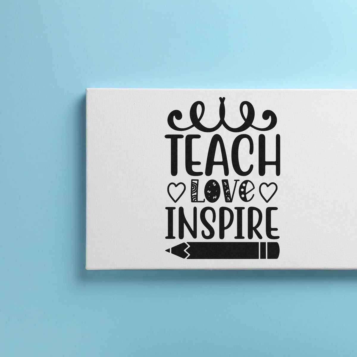 Black teacher-themed stamp seal with hearts, love, inspire text, and pencil on white canvas over light blue background