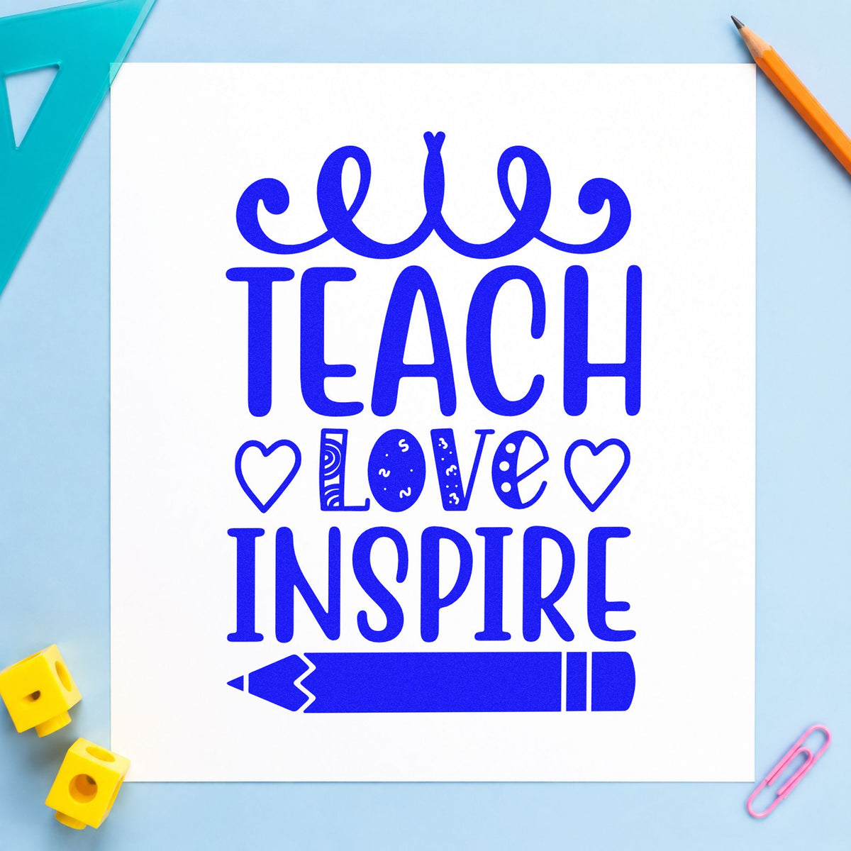 Teach Love Inspire Hearts Pencil craft stamp in blue ink on cardstock, an easy option for muslin cloth panels.