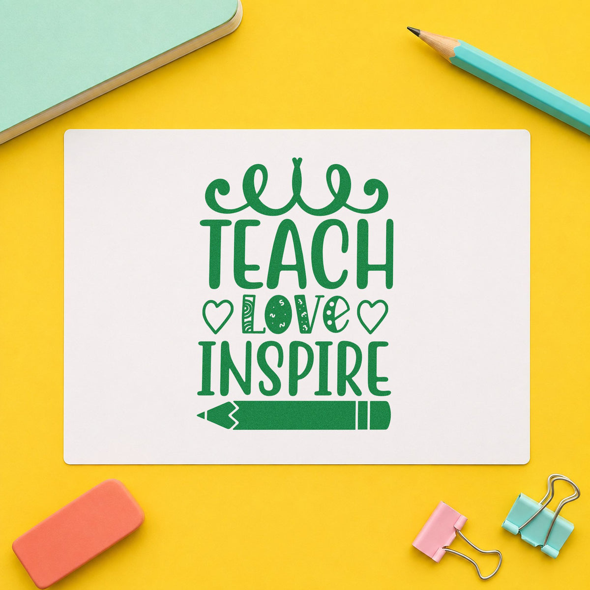 Teach Love Inspire Hearts Pencil craft stamp imprint in green ink on a handmade project, one idea being framed nursery loop.