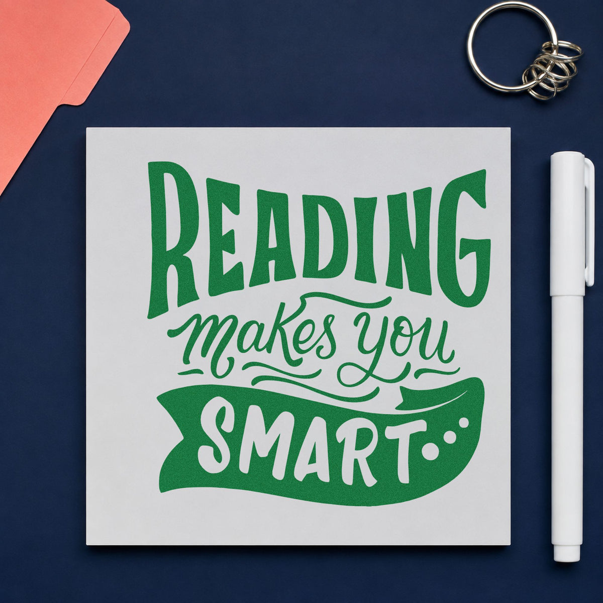 Reading Makes You Smart craft stamp imprint in green ink on a handmade project, one idea being tracker chart pages.