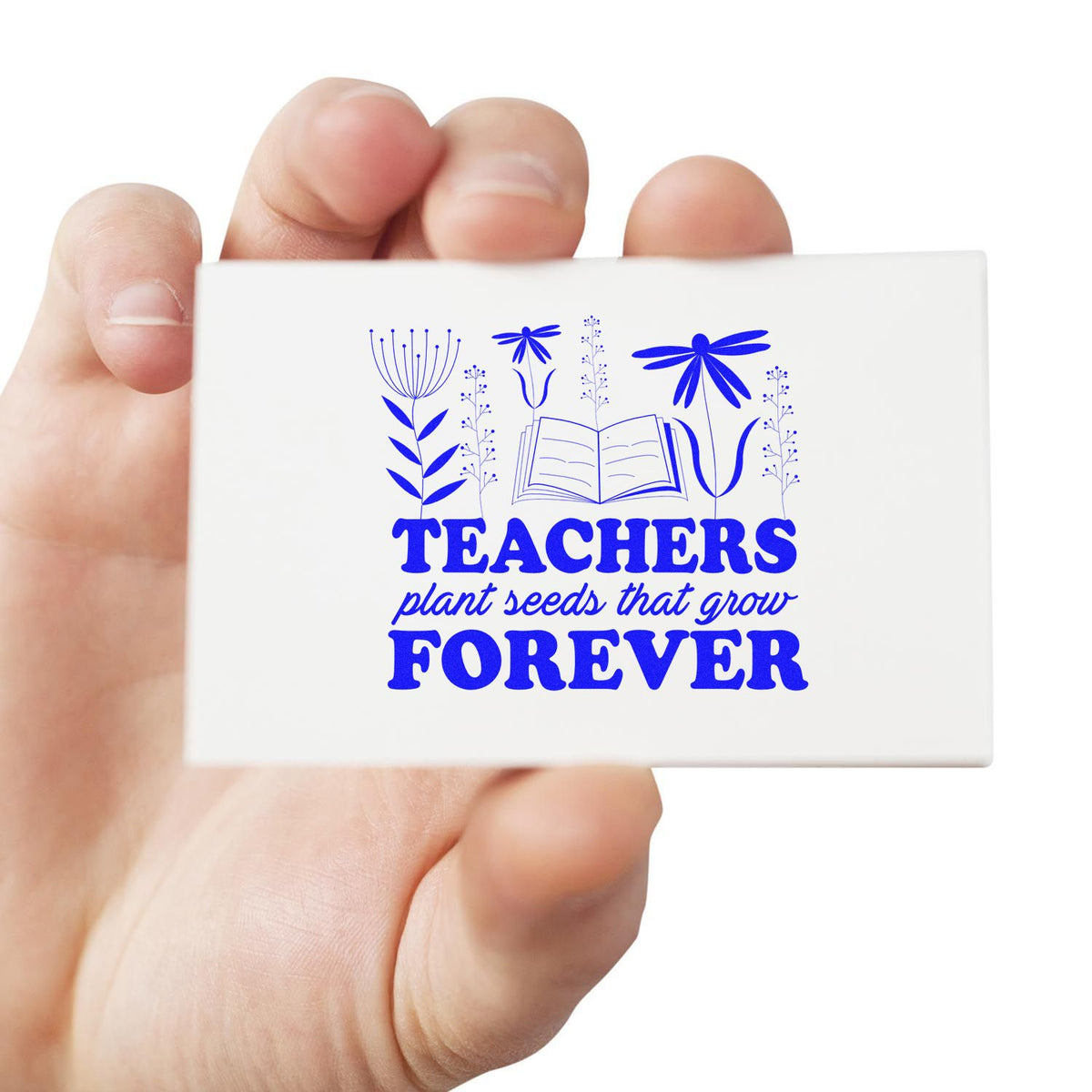 Teachers Plant Seeds Forever Book rubber stamp shown in blue ink, stamped for projects such as leaving gift tags.