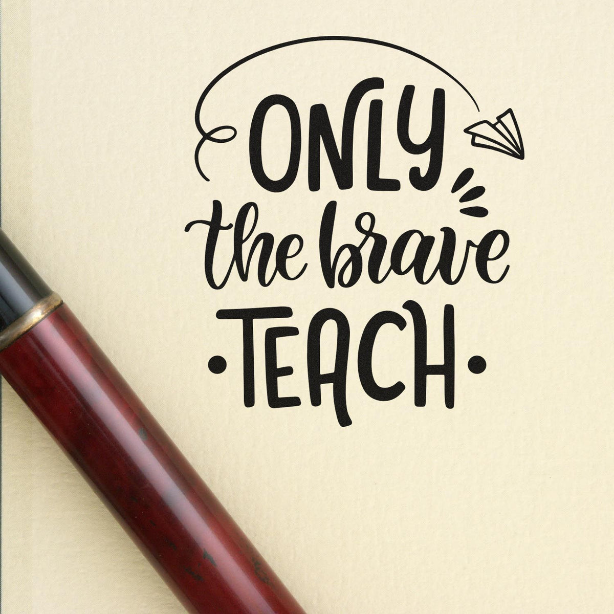Black Only the Brave Teach stamp and seal design with paper airplane on beige background, plus burgundy handle.