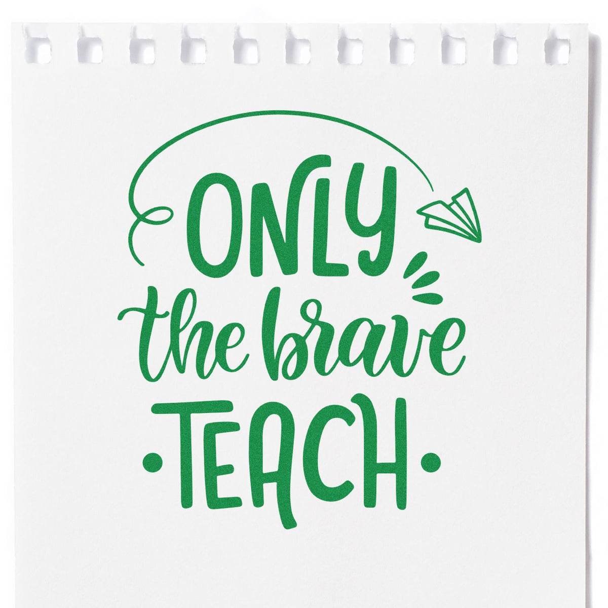 Green custom stamp on white tear-off notepad reading Only the Brave Teach, with paper plane accent.