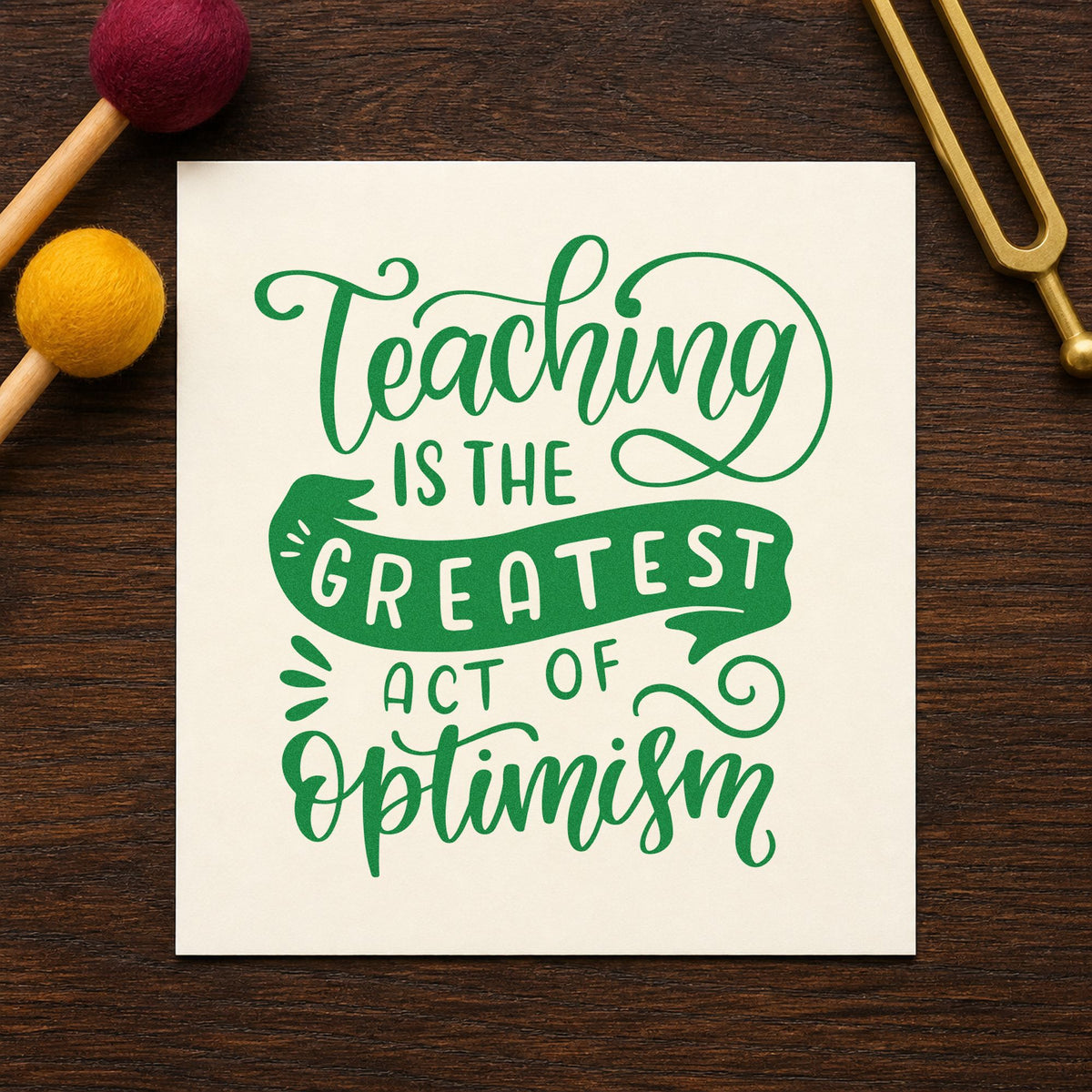 Teaching Greatest Act Of Optimism craft stamp imprint in green ink on a handmade project, one idea being framed staff entry.