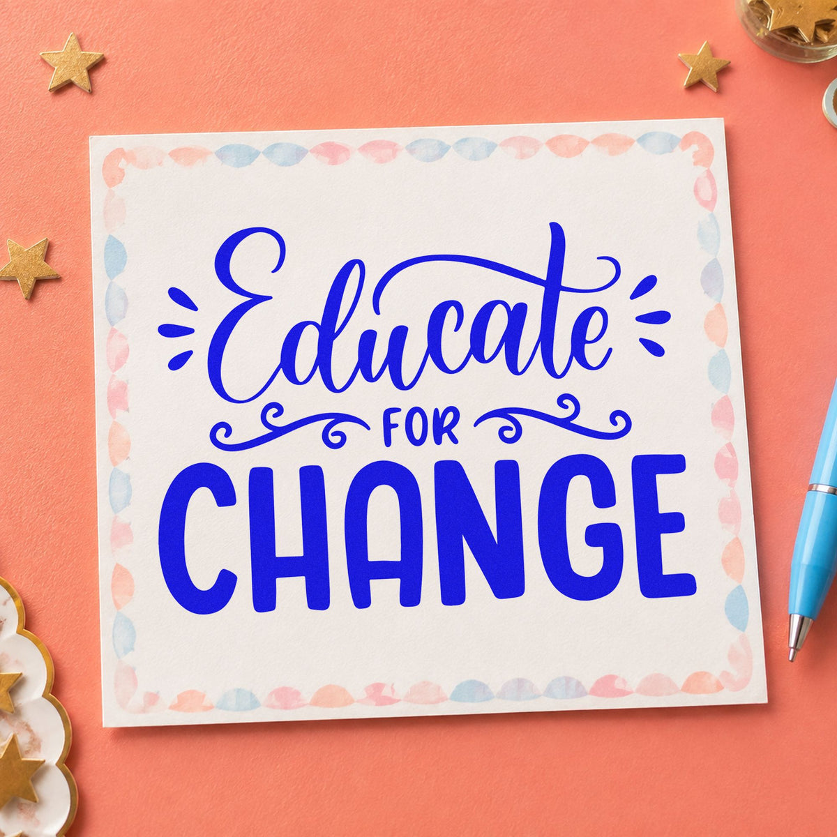 Educate For Change craft stamp in blue ink on cardstock, an easy option for delegate bag panels.