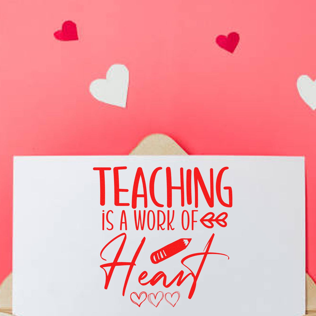 White teacher stamp card with red Teaching is a work of Heart text, pencil icon and hearts on pink background.