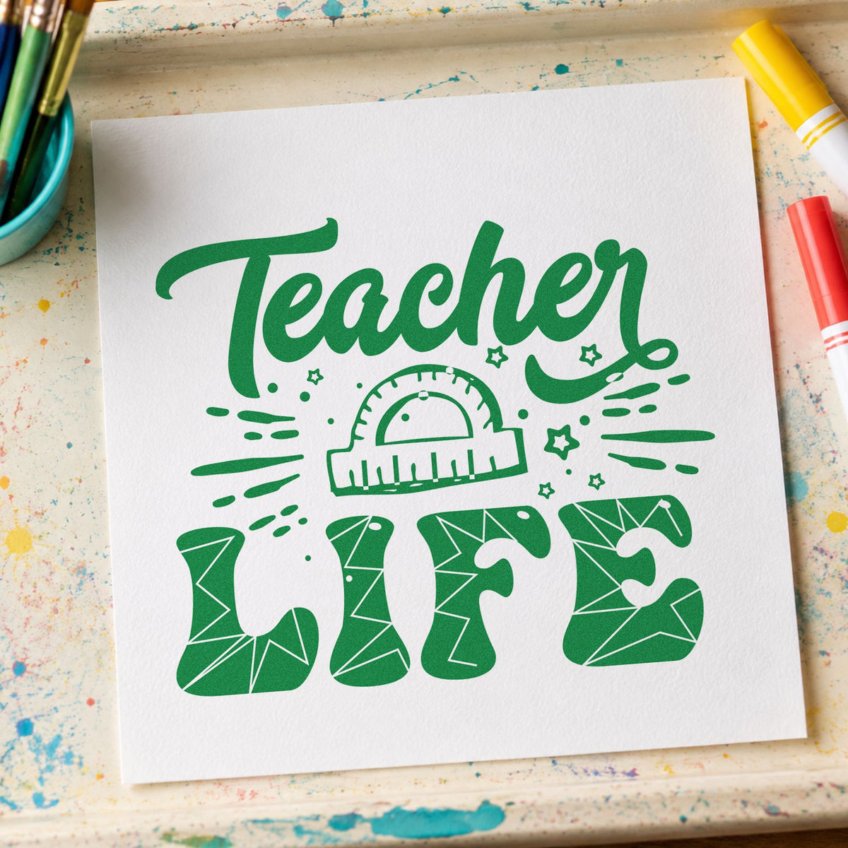 Teacher Life Geometry Pattern craft stamp imprint in green ink on a handmade project, one idea being angle work pages.