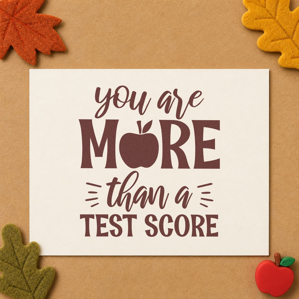 More Than A Test Score rubber stamp printed in brown ink, ready for helpline card labels and similar paper crafts.