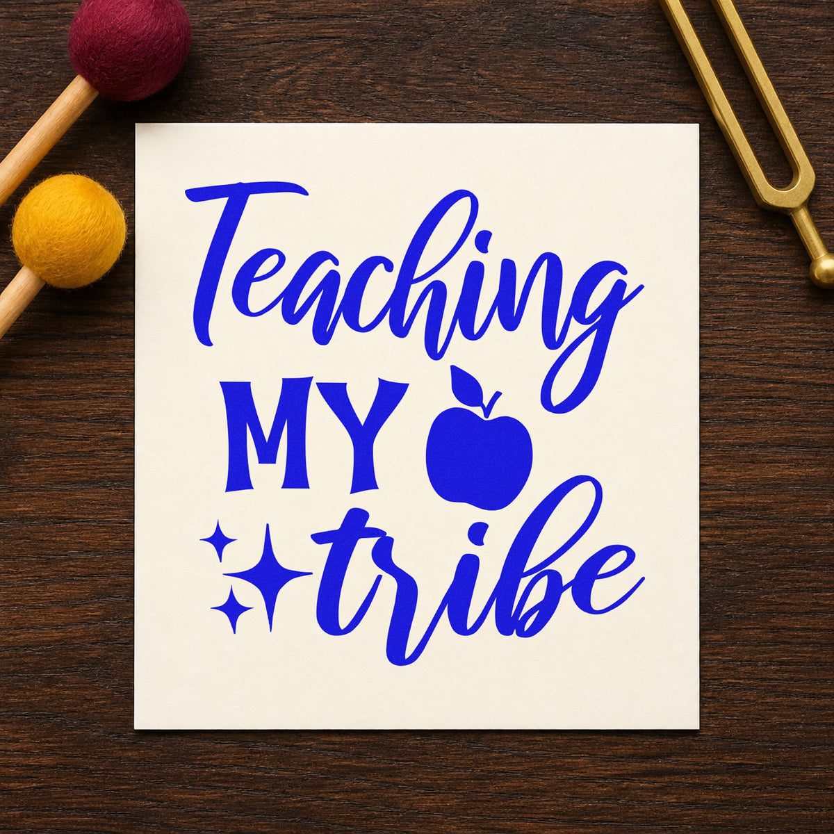 Teaching My Tribe Apple craft stamp imprinted in blue ink on paper, a design suited to charter fold seals.