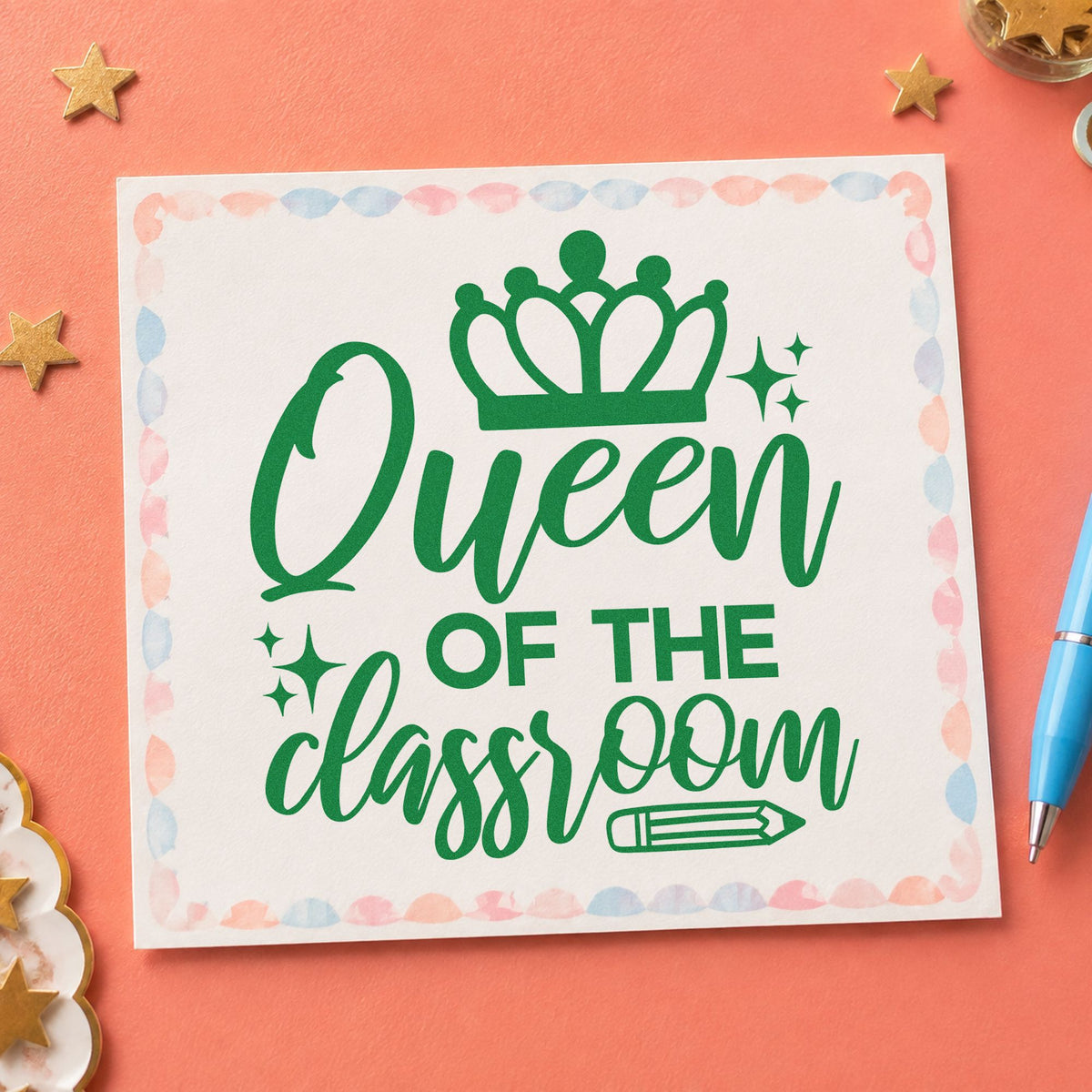 Queen Of The Classroom Crown craft stamp imprint in green ink on a handmade project, one idea being framed office wall.