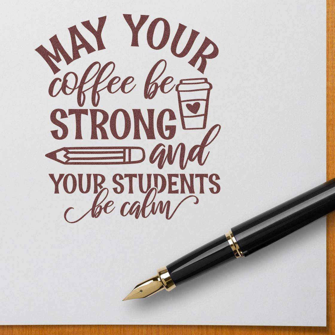 Burgundy teacher stamp/seal reading May your coffee be strong and your students be calm, with cup, pencil, and fountain pen.