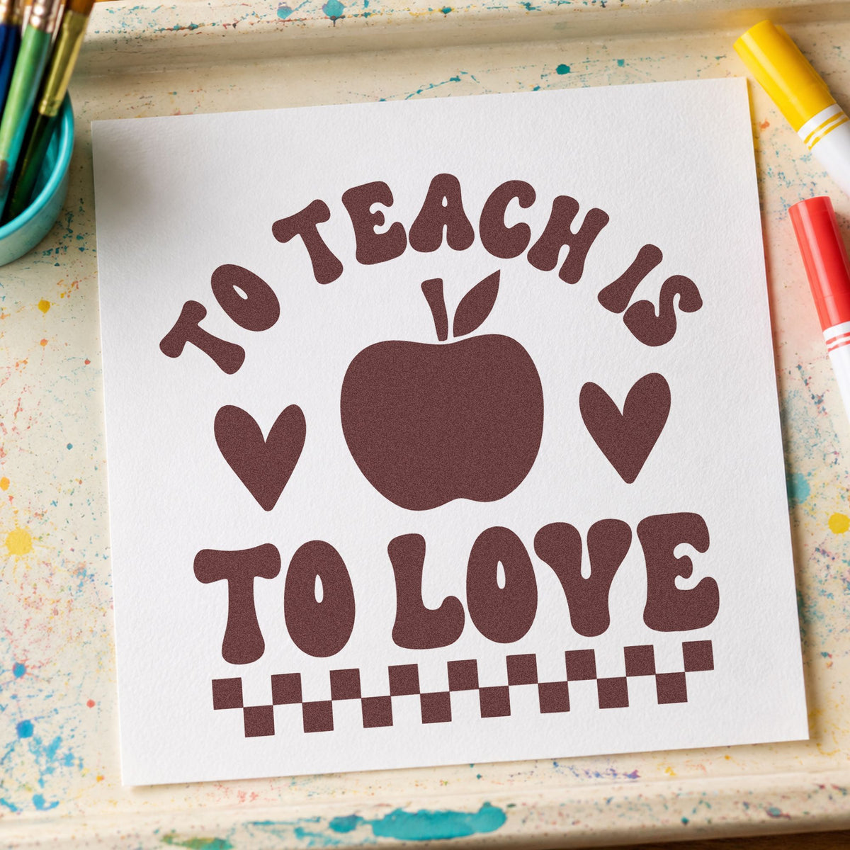 To Teach Is To Love rubber stamp printed in brown ink, ready for cupcake box labels and similar paper crafts.
