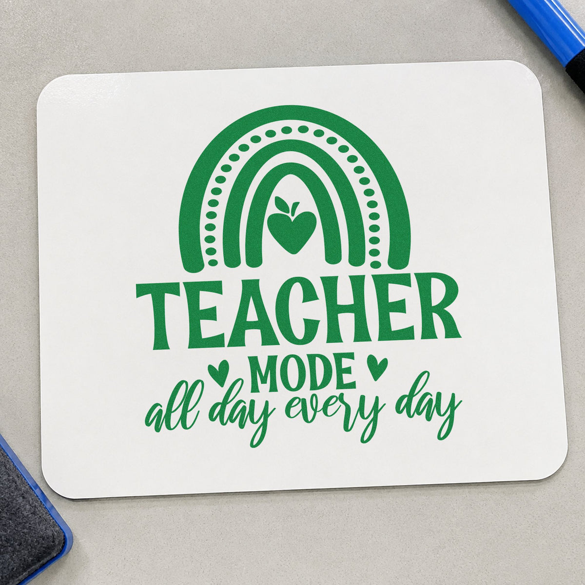 Teacher Mode Rainbow Apple craft stamp imprint in green ink on a handmade project, one idea being framed cloakroom arc.