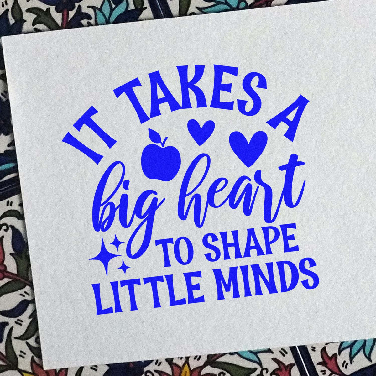 Big Heart Shape Little Minds rubber stamp shown in blue ink, stamped for projects such as setting visit tags.