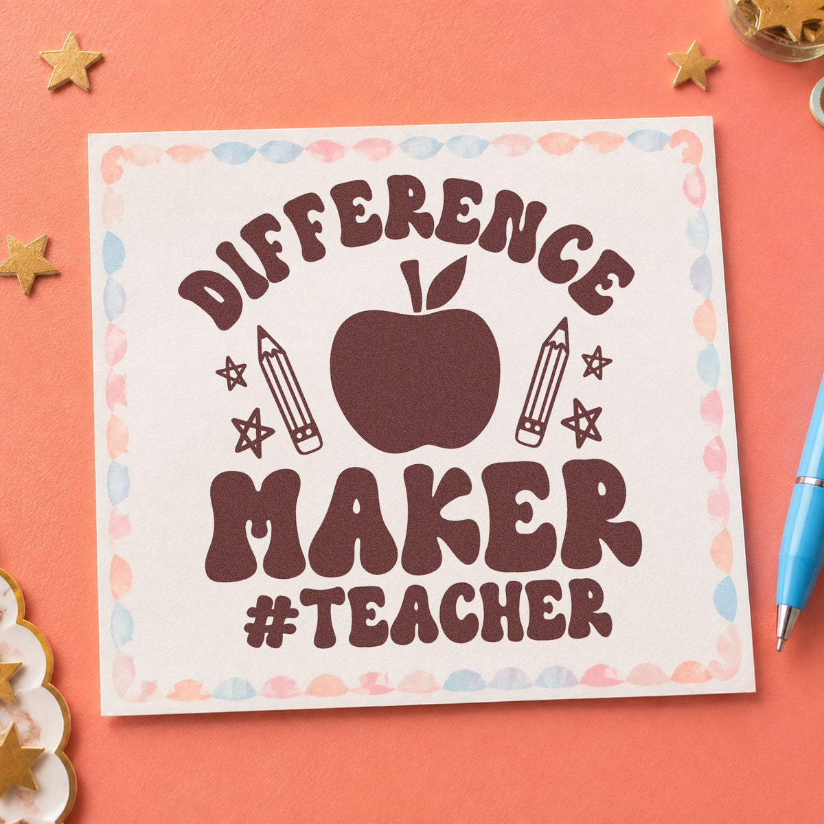 Difference Maker Teacher Apple rubber stamp printed in brown ink, ready for pin backing labels and similar paper crafts.