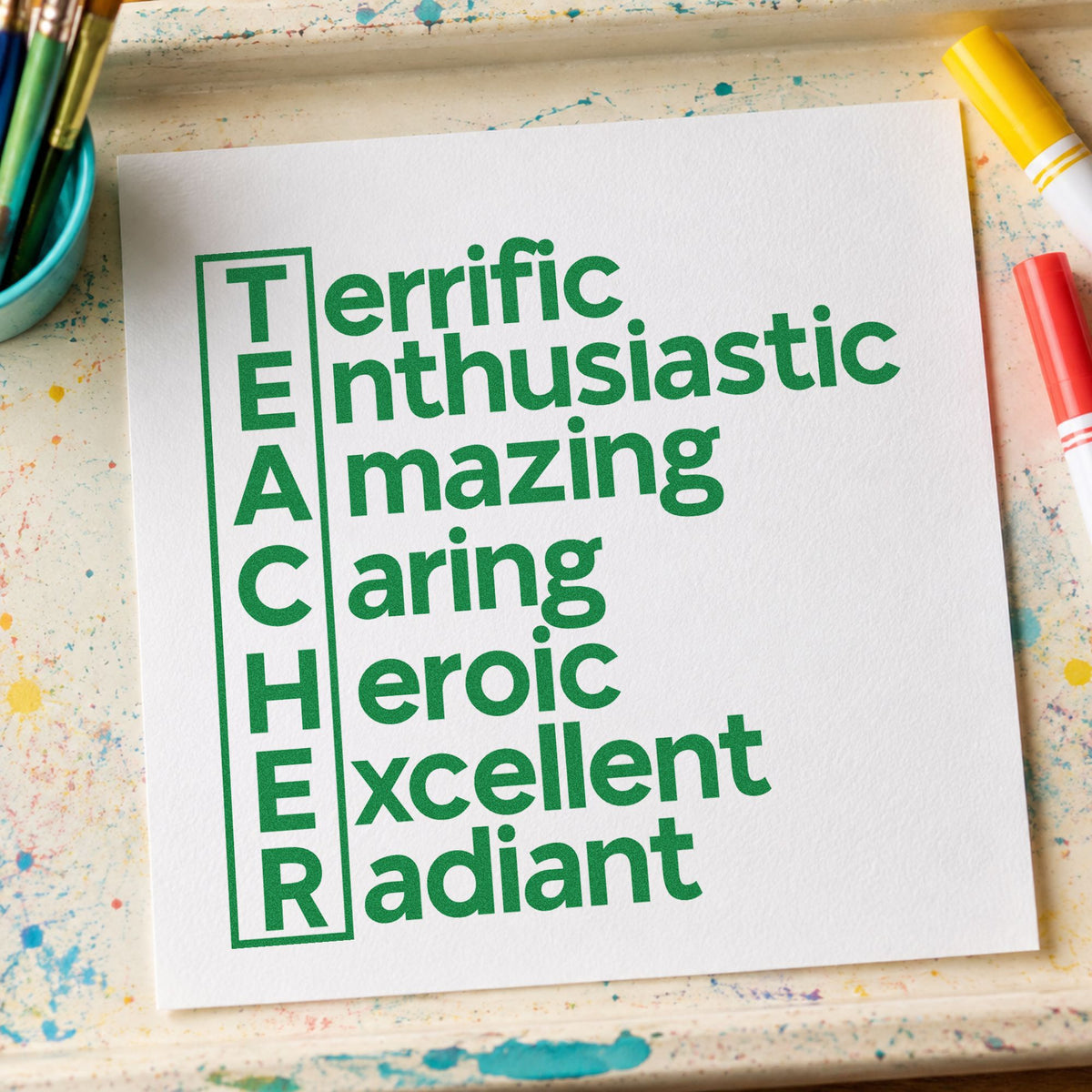 Teacher Traits Acrostic craft stamp imprint in green ink on a handmade project, one idea being acrostic work pages.