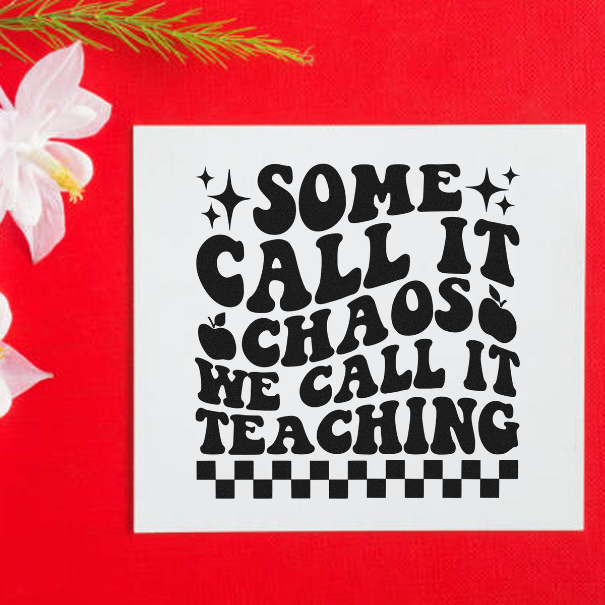 White stamp-and-seal design with black retro text Some call it chaos, we call it teaching on a bright red background.