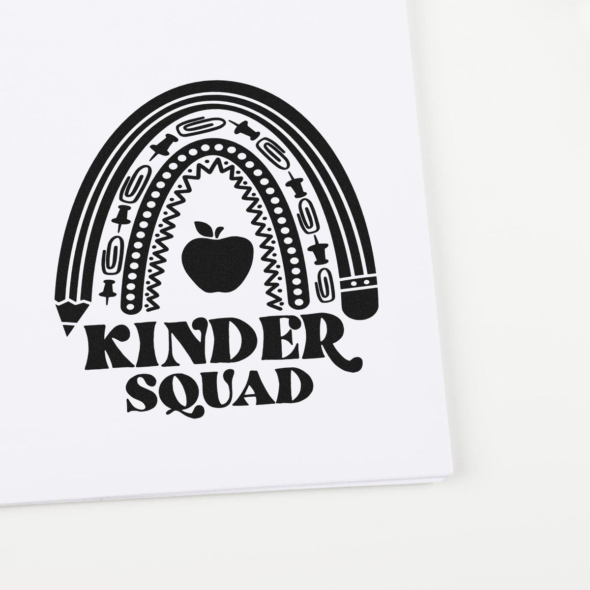 Black Kindred Squad stamp seal with rainbow, apple, and retro chain pattern on a white background