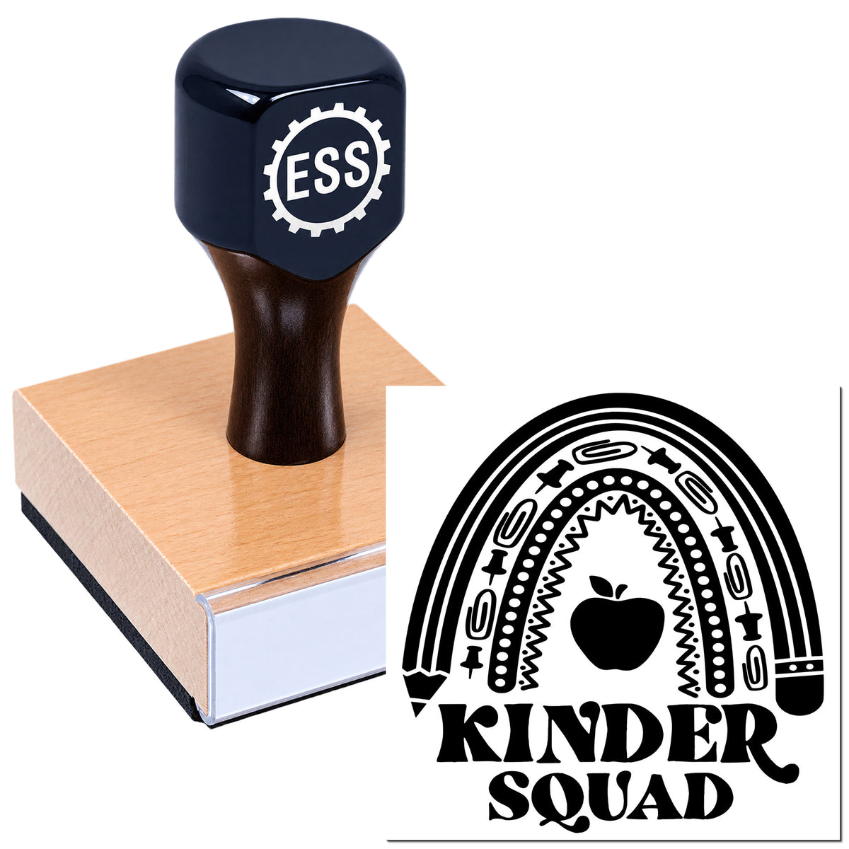 Black ESS rubber stamp on wooden block beside Kinder Squad rainbow seal with apple icon.