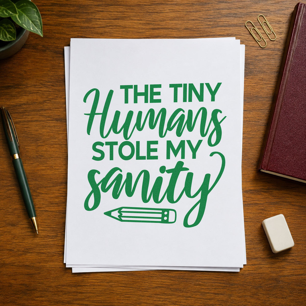 Tiny Humans Stole Sanity craft stamp imprint in green ink on a handmade project, one idea being map sheet pages.