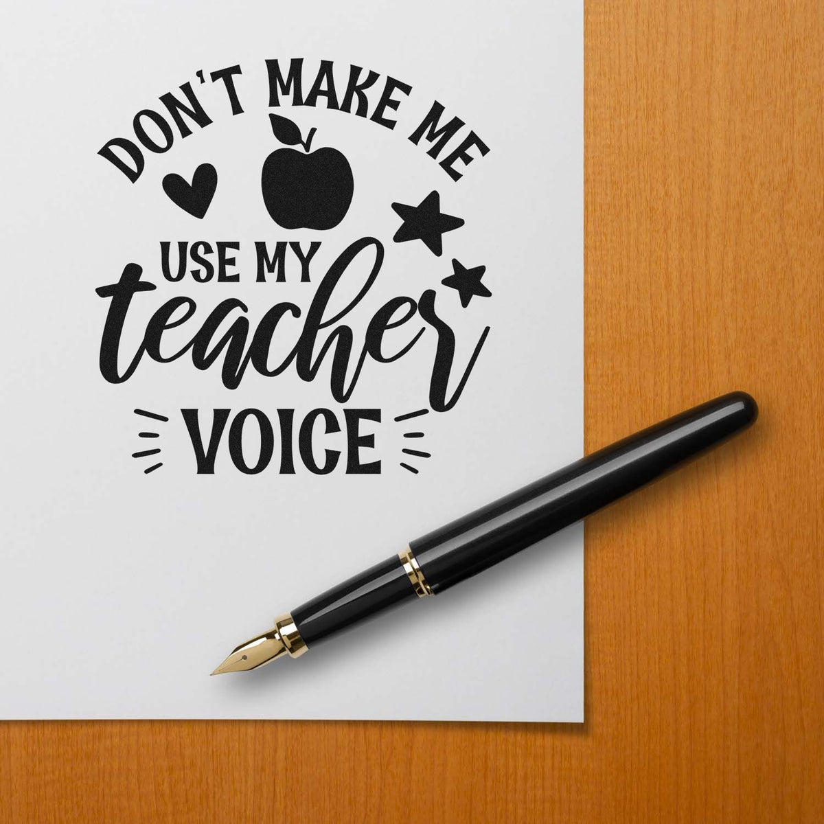 Don't Make Teacher Voice Stamp - Premium Vintage Pro Wooden imprint stamped in black ink. "Don't Make Me Use My Teacher Voice" features an apple, heart, stars, and accent strokes.