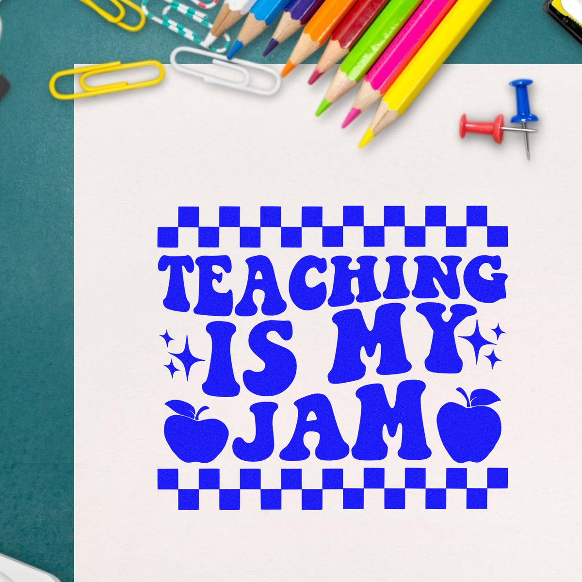 Blue teaching stamp/seal design reading Teaching Is My Jam, with checkered border, apple icons, and colored pencils.