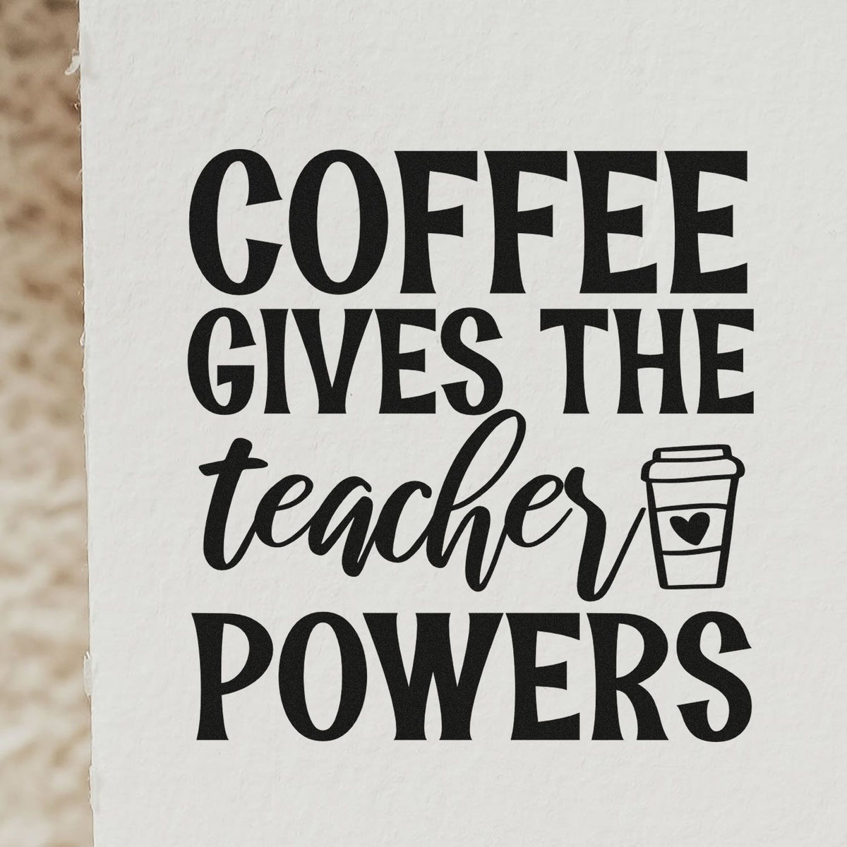 Black coffee-themed rubber stamp design reading Coffee Gives the Teachers Powers with a coffee cup icon on white paper.