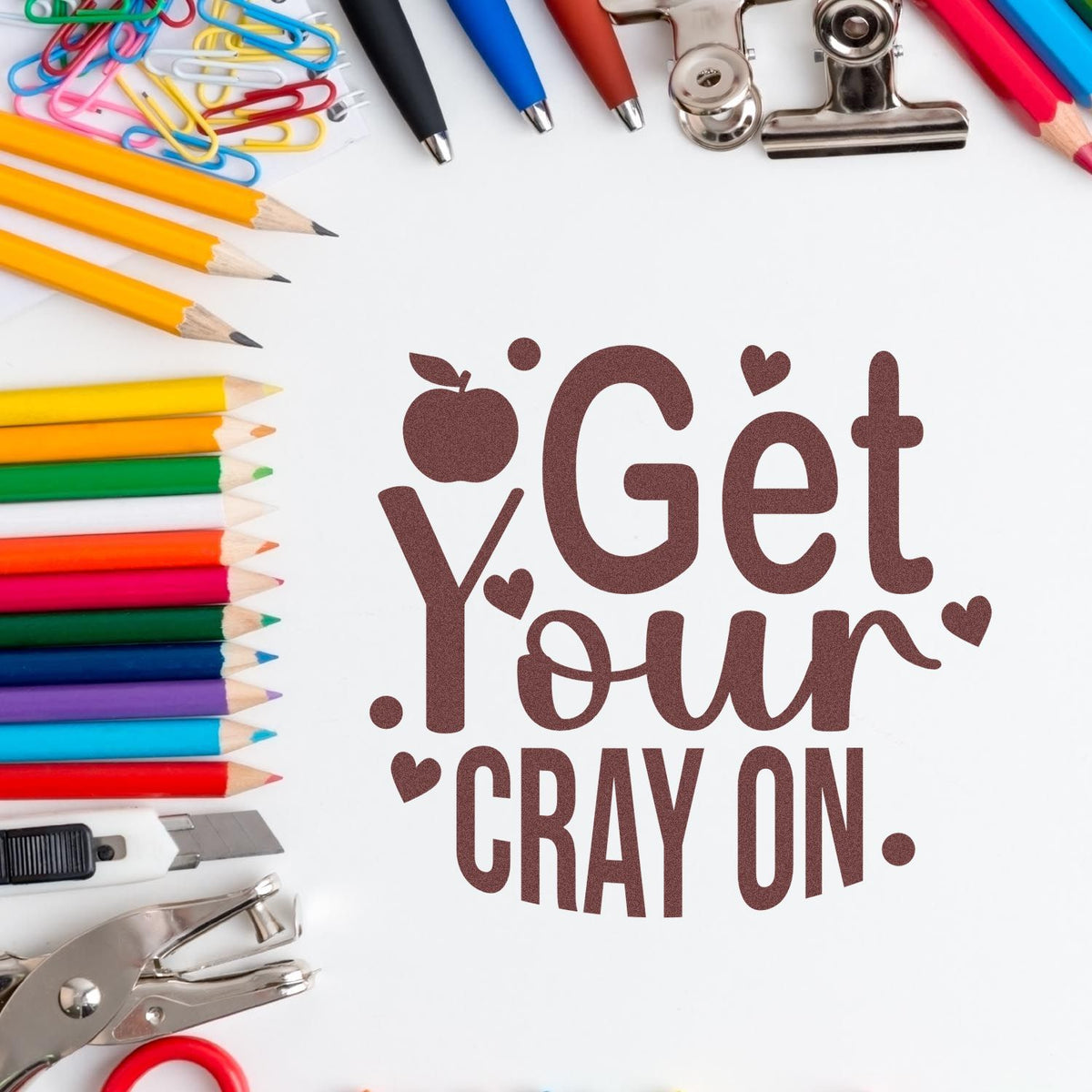 Brown Get Your Cray On stamp and seal design with colorful pencils, paper clips, pens, binder clips, and craft tools.