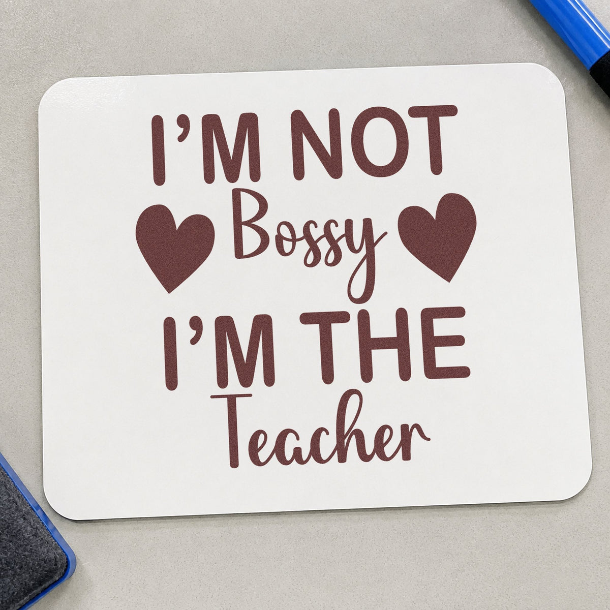 Not Bossy I'm The Teacher rubber stamp printed in brown ink, ready for key hook labels and similar paper crafts.