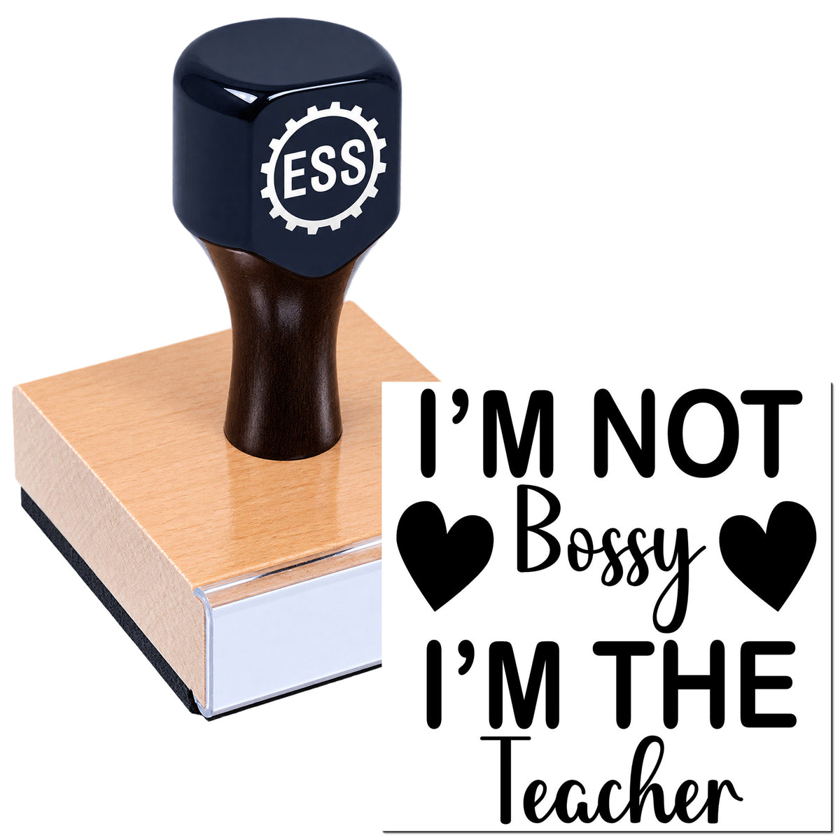 Dark navy ESS seal stamp with wooden base and black slogan: "I'm not bossy, I'm the teacher."